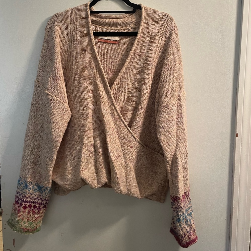 Anthropologie sweater with cross front and beautiful sleeve embellishment